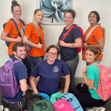 Cleaning staff with backpacks and supplies